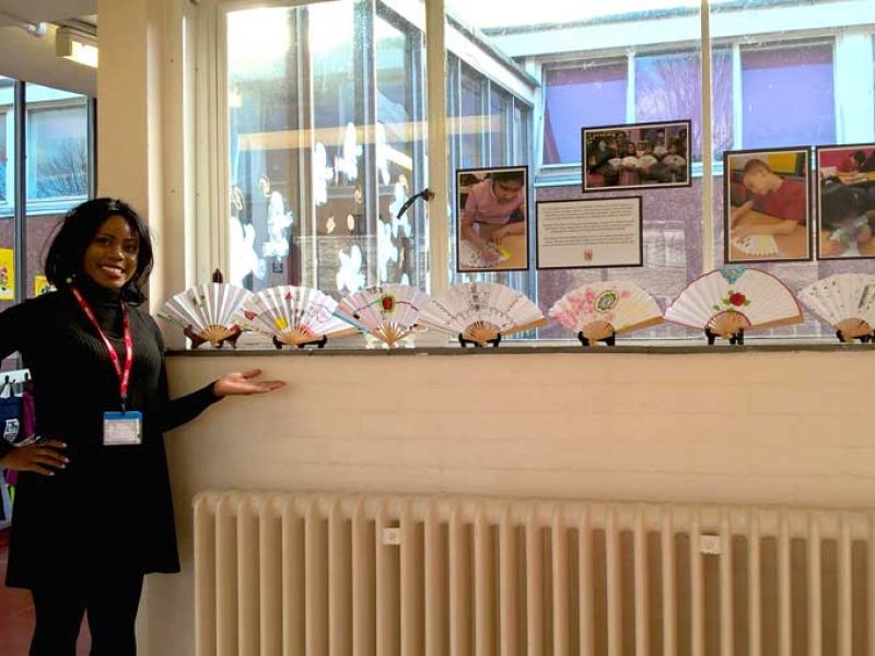 Victoria Ajoku proudly showing the work of some students